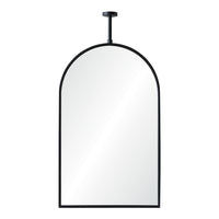 Arch-shaped mirror with black frame on a white background