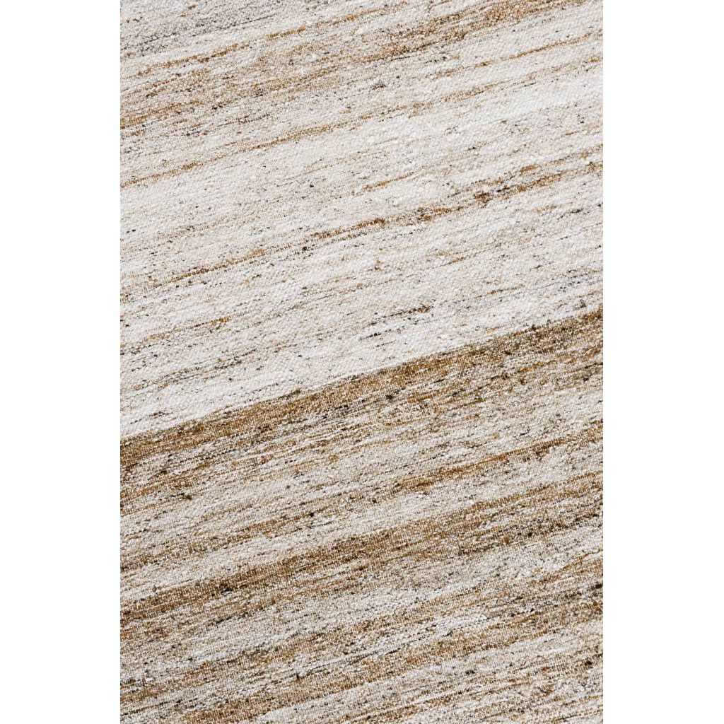 Close-up of the Indoor/Outdoor Plateau Rug - Sand Ombre by Classic Home, featuring a durable, textured diagonal pattern.