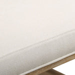 Close-up of the Uttermost Lithe Desk Chair's beige cushion with visible stitching and solid wood frame.