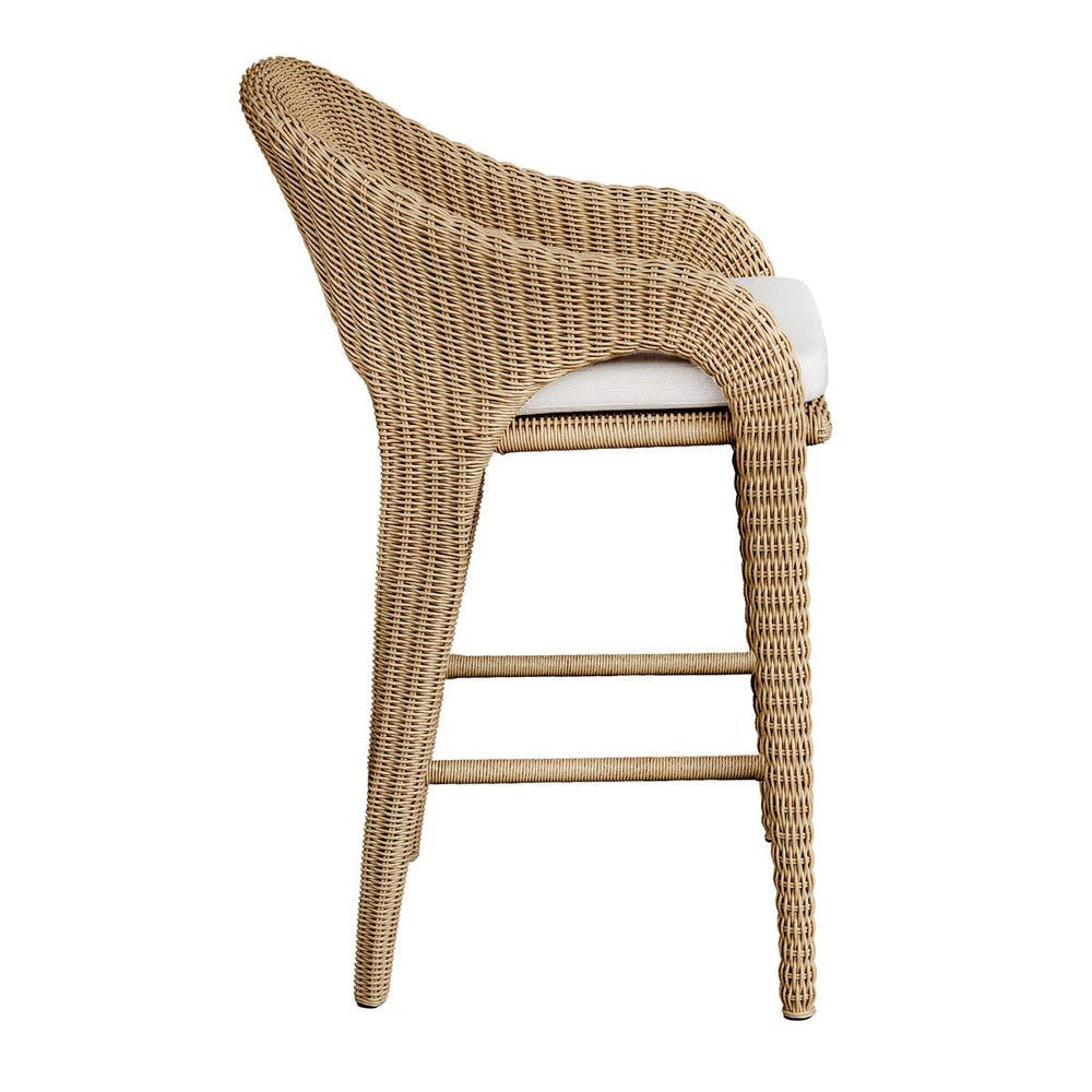 Wicker bar stool with a white cushion on a white background