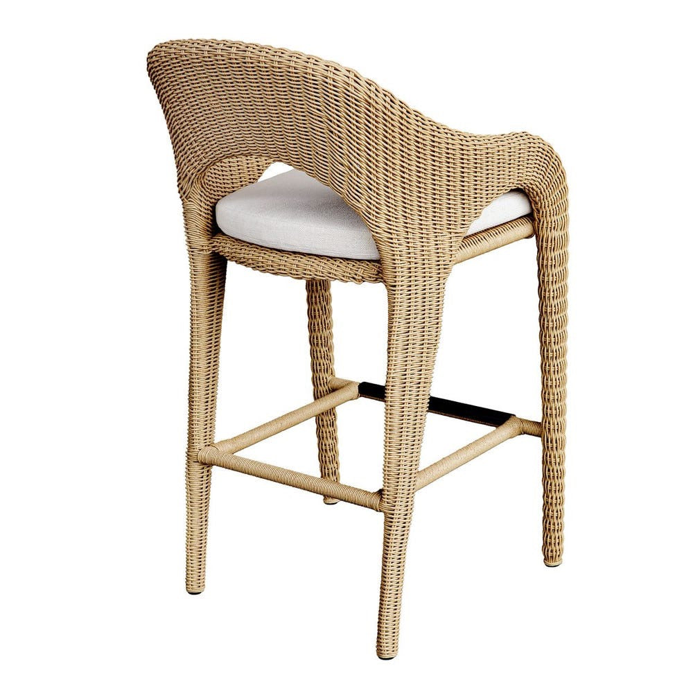 Wicker bar stool with a white cushion on a white background