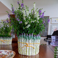 Decorative vase with flowers on a wooden table