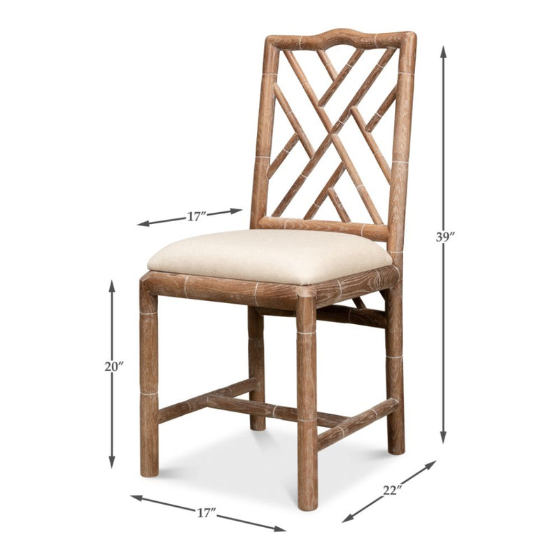 The Brighton Bamboo Whitewashed Side Chairs (set of 2) by Sarreid, Ltd. feature hand-carved oak frames with neutral linen cushions and decorative backrests; dimensions are marked for height (39"), seat height (20"), width (17"), and depth (22").