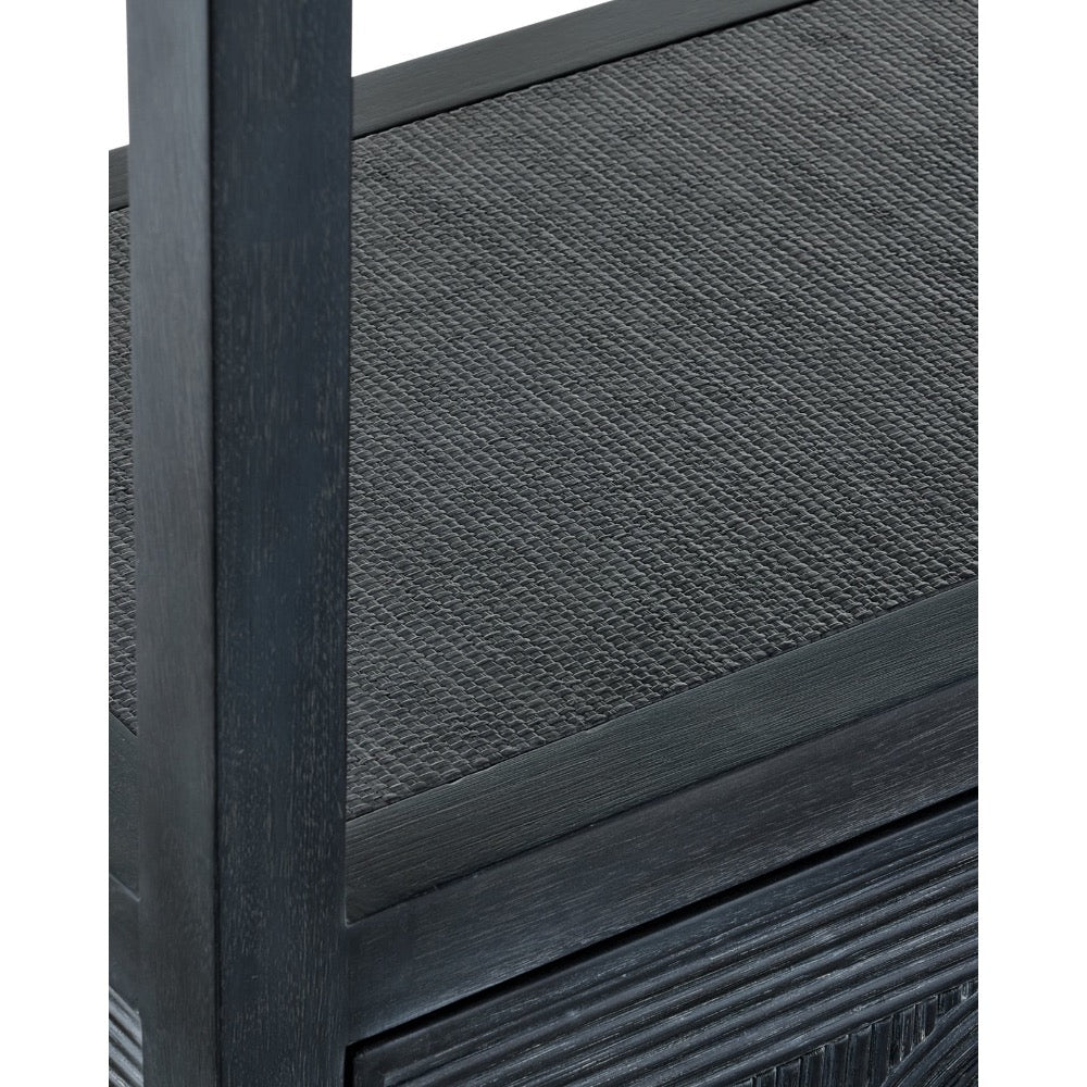 Close-up detail of a dark charcoal textured furniture piece with a black wood frame, showing woven or ribbed paneling and a vertical post.
