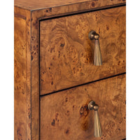 Close-up of a wooden chest or cabinet with two drawers, featuring a rich burl wood grain finish in warm brown tones and bronze-toned pull handles.