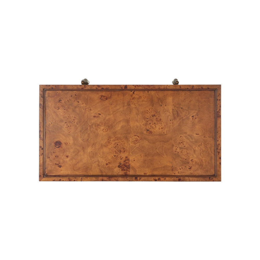 Top view of a wooden dresser with a burl wood grain finish.