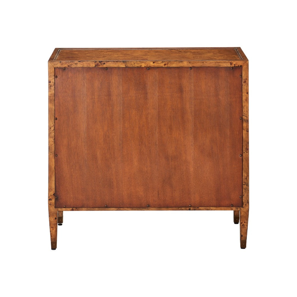 A vintage wooden chest or cabinet with a warm reddish-brown finish, featuring visible metal rivets along the edges and legs, shown against a plain white background.