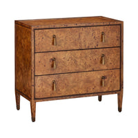 A three-drawer wooden chest of drawers with a rich burl wood grain finish in warm brown tones, featuring brass pull handles and tapered legs, shown against a plain white background.
