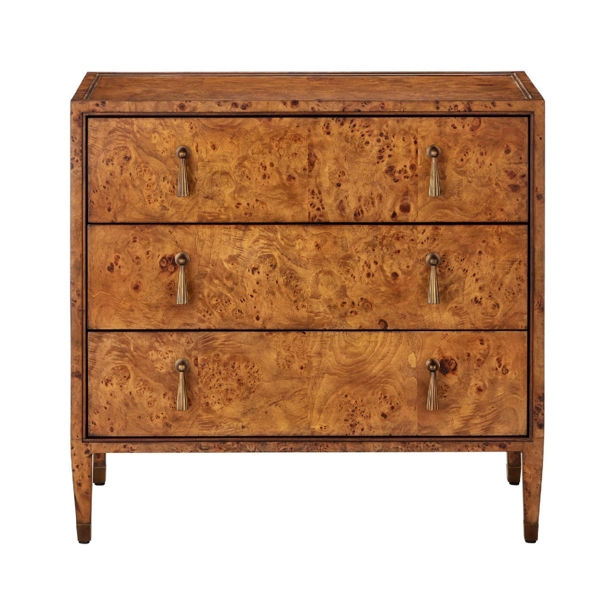 A three-drawer wooden chest of drawers with an intricate burl wood grain pattern in warm golden-brown tones, featuring small metal pull handles and tapered legs, shown against a plain white background.