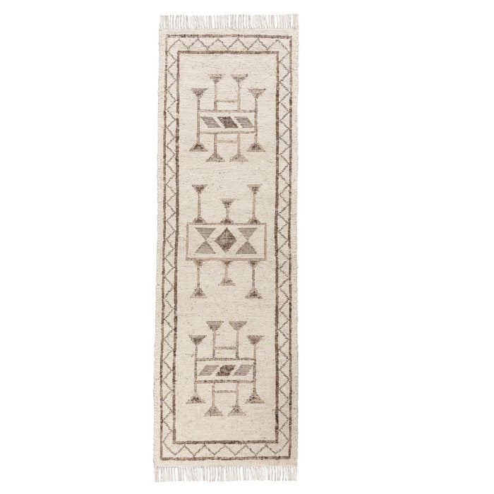 A long rectangular area rug with a cream and taupe geometric pattern and fringe on both ends, shown flat against a white background.
