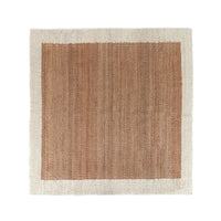 A square woven rug with a natural tan center and a light beige border, shown flat against a white background.