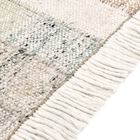 Close-up of a textured rug with fringe detail
