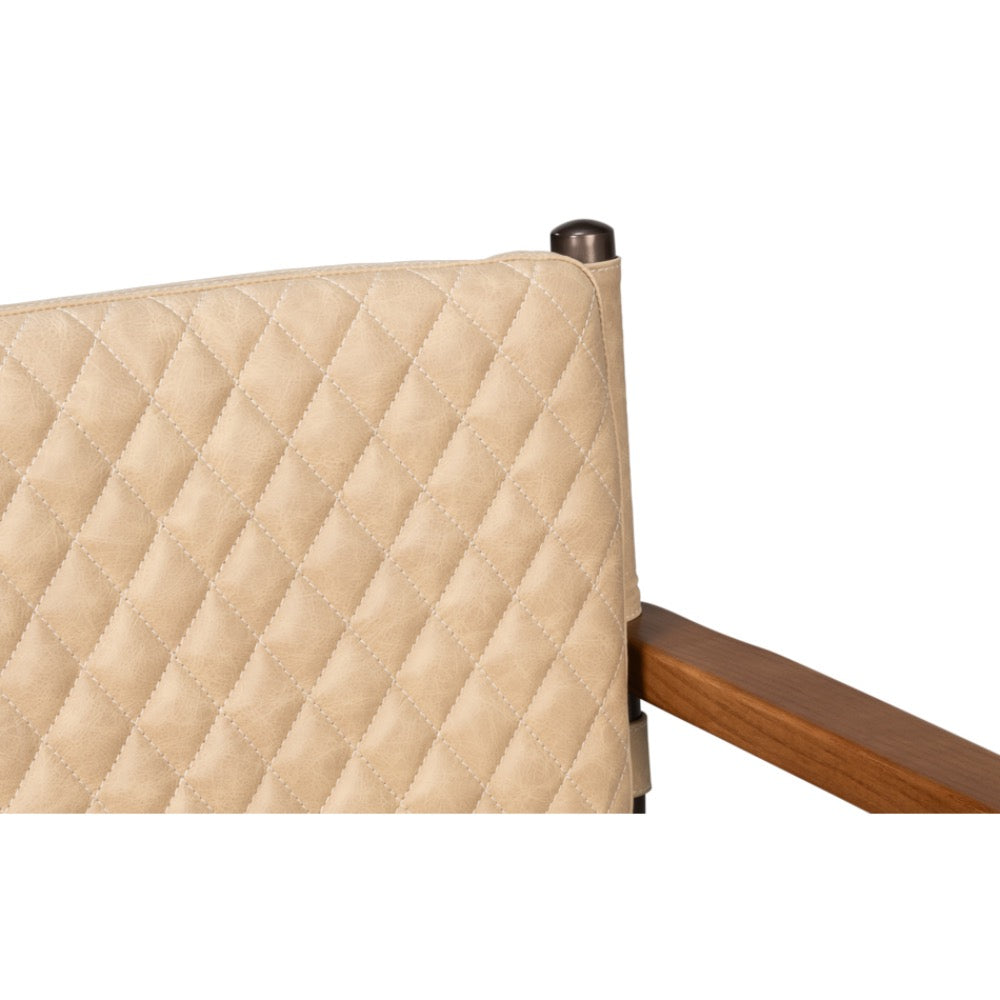 closeup beige quilted leather armchair backrest
