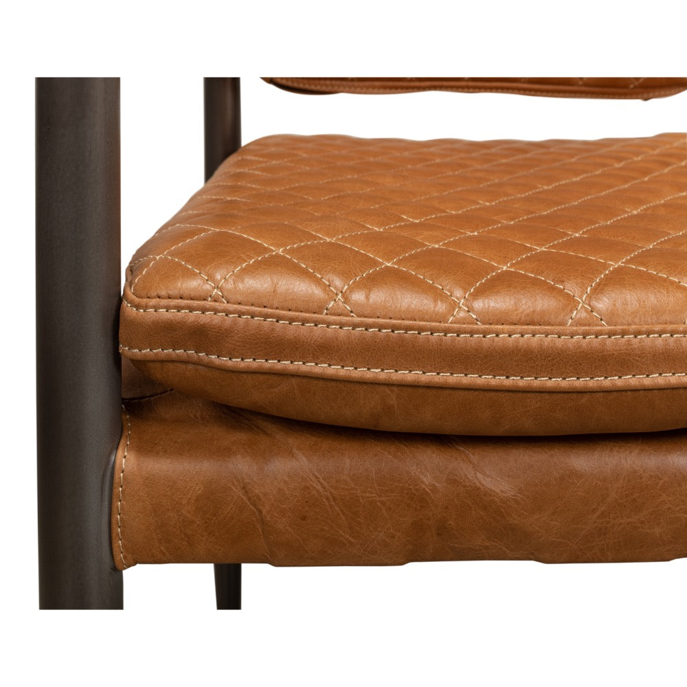 close up brown quilted leather cushion