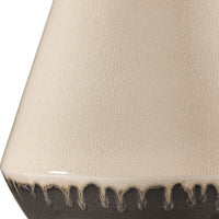 Close-up of a textured ceramic vase with a white background