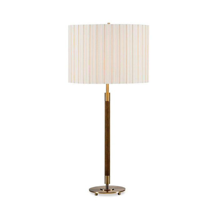 A modern table lamp with a cylindrical pleated fabric shade in cream and light tan stripes, supported by a slim dark wood central column and a polished brass base.