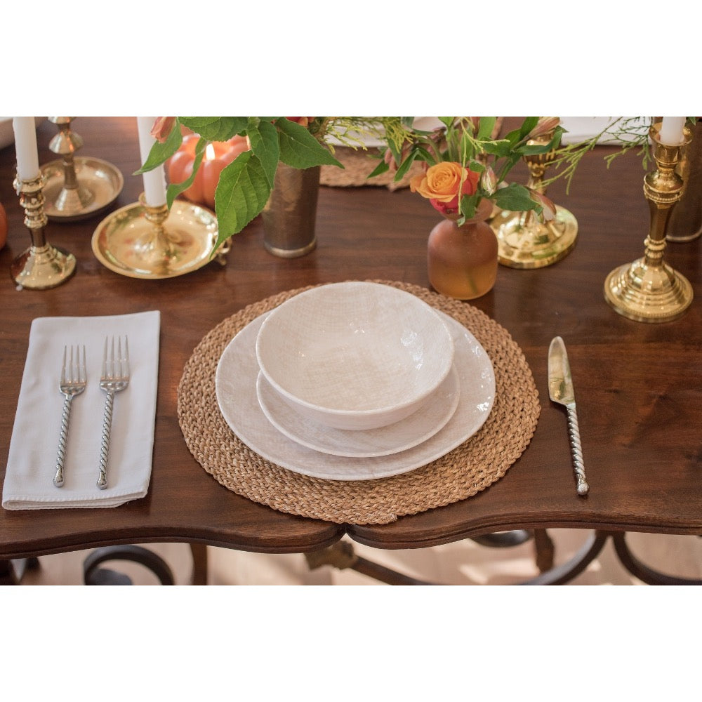 Elegant table set with Always Relish Weave Cream Melamine Salad Plates, white dishes, woven placemat, and flowers.