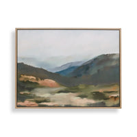 A framed landscape painting featuring misty mountains and a valley in muted tones of blue, green, brown, and beige, set against a clean white background.