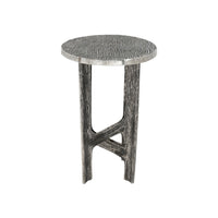 A round accent side table with a textured, wavy wood-grain top and a sculptural, branch-like base in a weathered gray finish, shown against a plain white background.