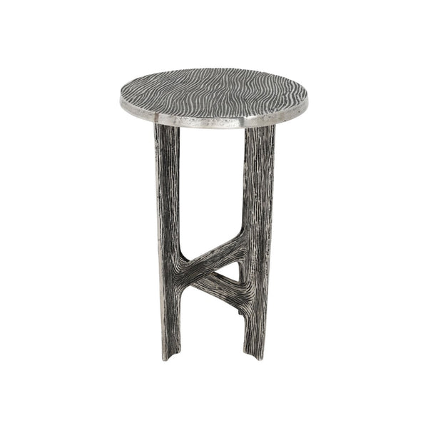 A round accent side table with a textured, wavy wood-grain top and a sculptural, branch-like base in a weathered gray finish, shown against a plain white background.