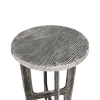 A round side table with a textured, distressed gray and white wood grain finish, shown against a plain white background.