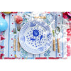 Abigails Casa Nuno Blue Pomegranate Dinner Plates (set of 2) with bamboo cutlery on a vibrant, patterned tablecloth.