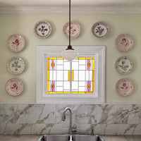 Kitchen wall featuring Abigails Casa Nuno Green Dinner Plates (set of 2) above a marble backsplash and sink.