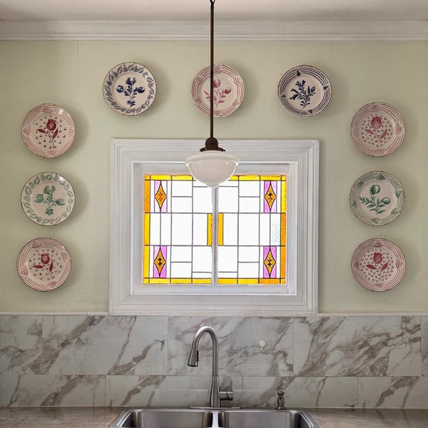 Kitchen wall featuring Abigails Casa Nuno Green Dinner Plates (set of 2) above a marble backsplash and sink.