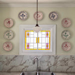 Kitchen wall featuring Abigails Casa Nuno Green Dinner Plates (set of 2) above a marble backsplash and sink.
