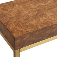 Wooden table with gold base on a white background