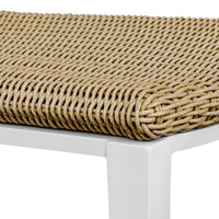 Woven dining seat with white frame on a plain background