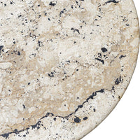 Close-up of a beige marble surface with black speckles