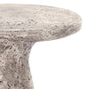 Close-up of Classic Home's Collins Concrete Accent Table in rust—its speckled finish is perfect for outdoor spaces.