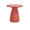 The Collins Concrete Accent Table by Classic Home features a rust color and stylish shape—ideal for outdoor spaces.