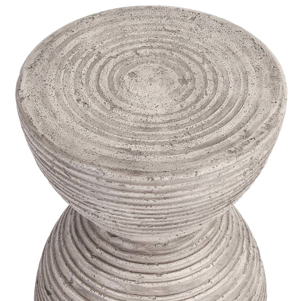 The Classic Home Corey Outdoor Accent Table is a round, ridged fiberglass-reinforced concrete patio or porch stool.