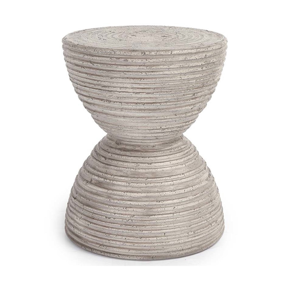 The Corey Outdoor Accent Table by Classic Home is gray, hourglass-shaped, with ridges and made of reinforced concrete.