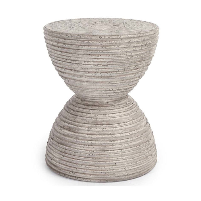 The Corey Outdoor Accent Table by Classic Home is gray, hourglass-shaped, with ridges and made of reinforced concrete.