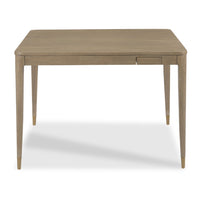 A rectangular wooden table with a light beige finish, featuring tapered legs and a small drawer on the front right side, shown against a plain white background.