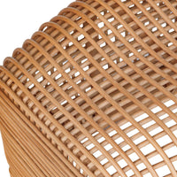 Close-up of a woven rattan bench seat showing the natural tan color and curved slatted pattern against a white background.
