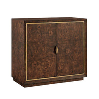 A two-door cabinet with a rich, dark brown burl wood grain finish and a thin brass trim border, featuring a single central brass pull handle.