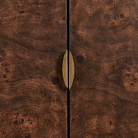 A close-up of a dark brown wood cabinet door with a vertical center seam and a single elongated brass handle in the middle.