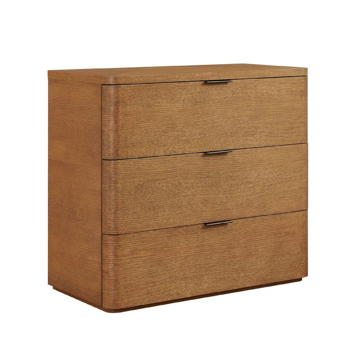 A three-drawer wooden chest of drawers with a warm medium-brown finish and slim dark metal handles, shown on a plain white background.