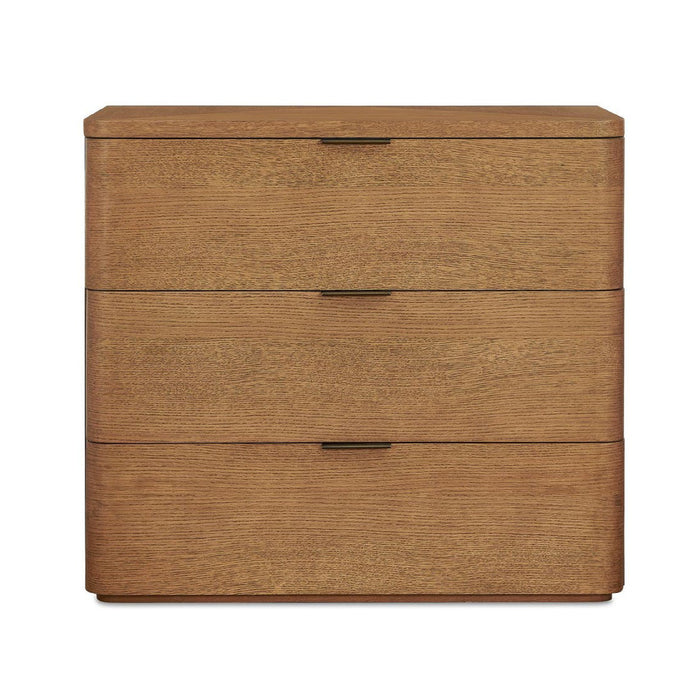 A three-drawer wooden nightstand or end table with a warm medium-brown wood grain finish and slim dark metal drawer pulls, shown against a plain white background.