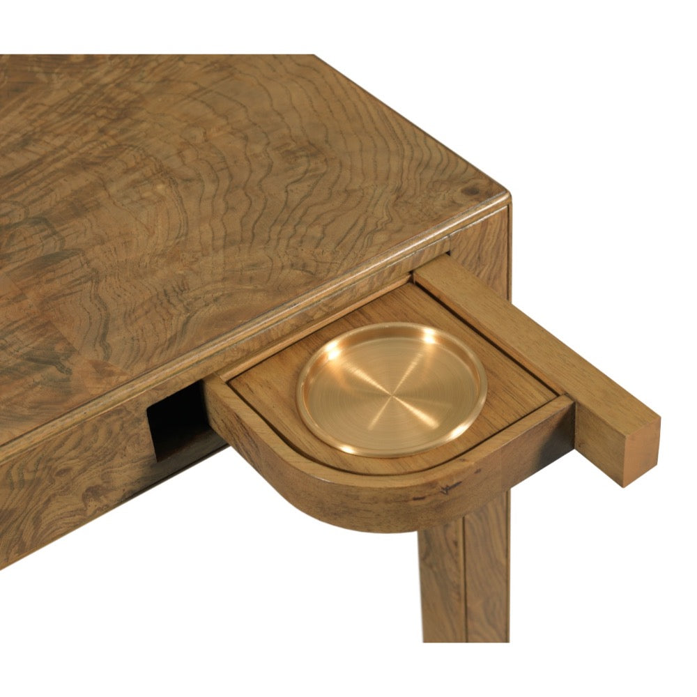 Wooden table with a gold circular tray inside a drawer on a white background