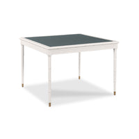 A square white table with a dark grey felt playing surface and slim tapered legs with gold-toned tips, shown on a white background.