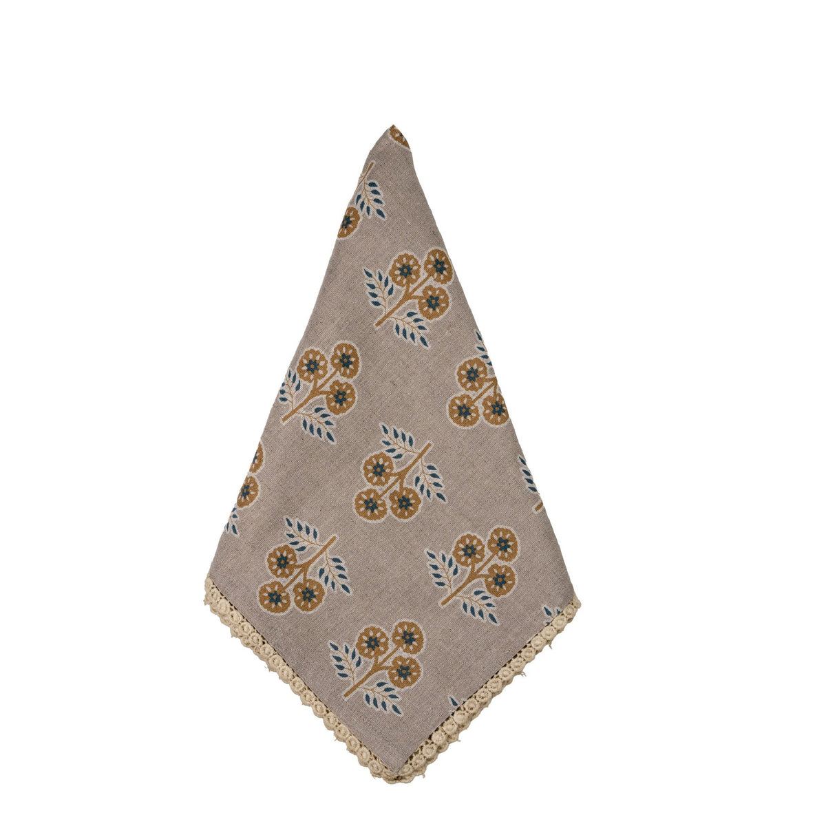 Folded  cloth napkin with a floral block-print pattern in beige, brown, and blue-gray.