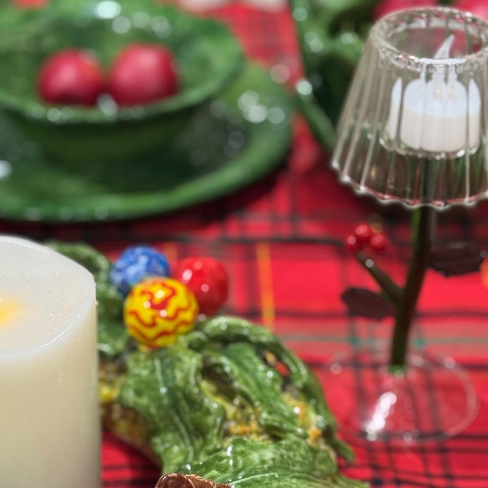 Decorative Christmas tree with candy on a red plaid tablecloth
