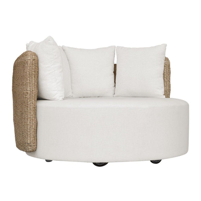 White armchair with woven armrests and white cushions on a white background