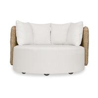 White cushioned chair with wicker armrests on a white background