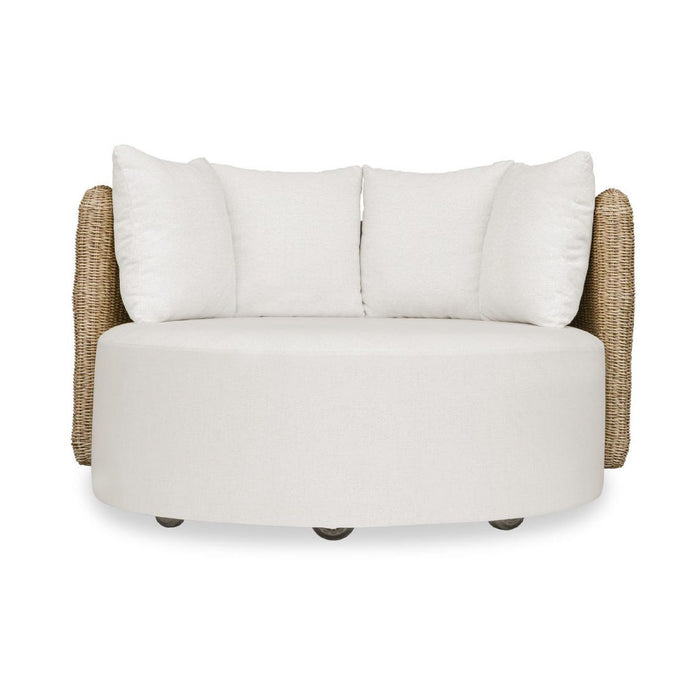 White cushioned chair with wicker armrests on a white background